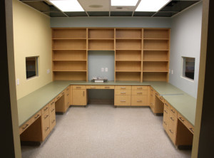 Exam room with counters and shelving
