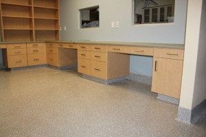 Exam room with counters and shelving