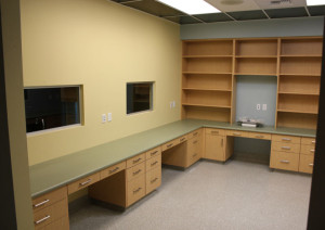 Exam room with counters and shelving