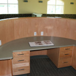 Reception desk with curved wood front