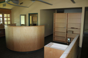 Reception desk with curved wood front