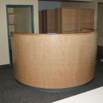 Reception desk with curved wood front