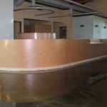 Reception area with curved wood partition